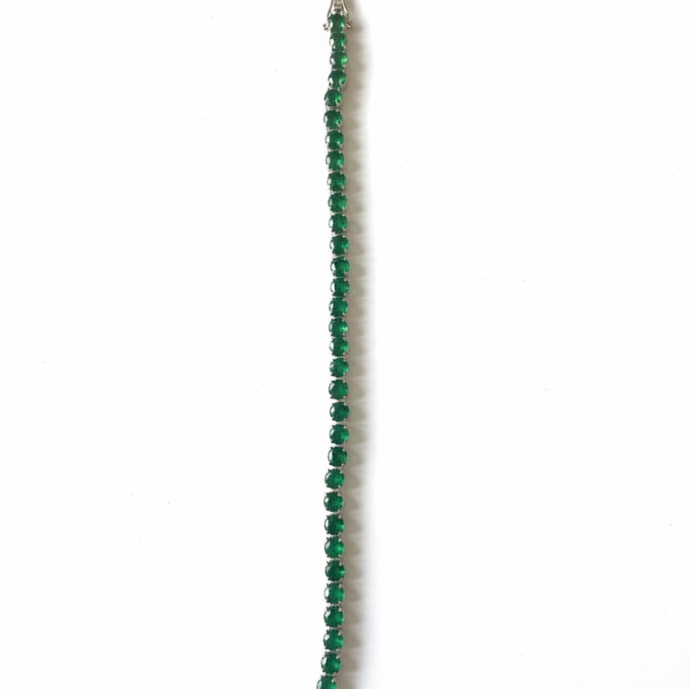 Emerald colored stone tennis bracelet